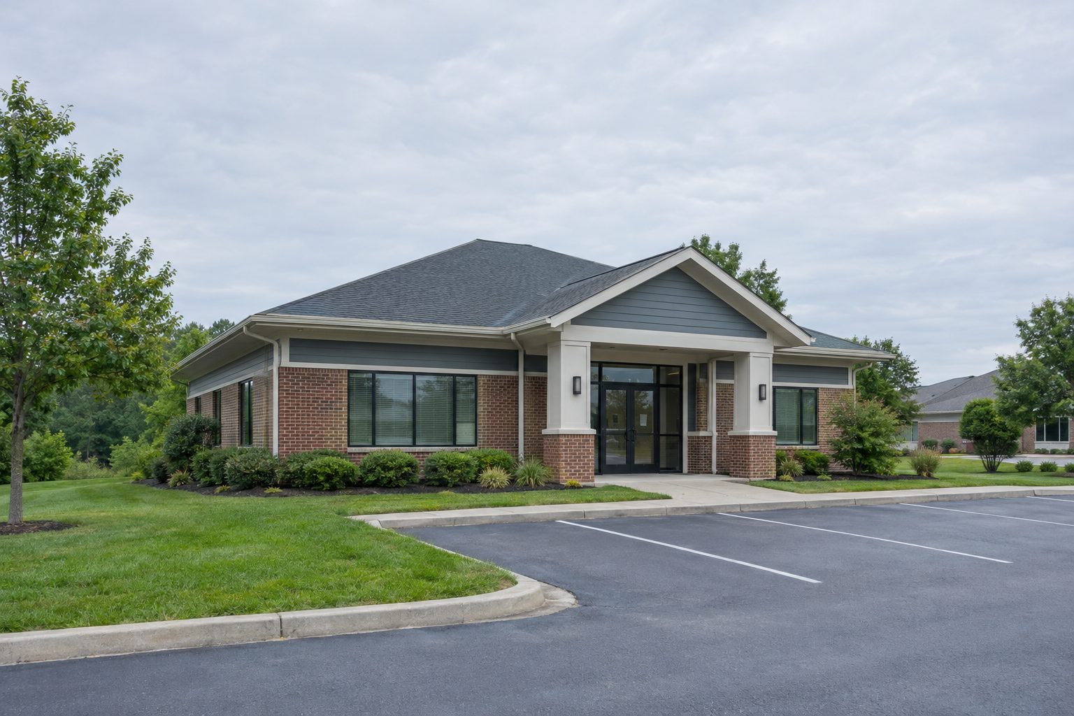 Single-story brick outpatient treatment building in a suburban office park